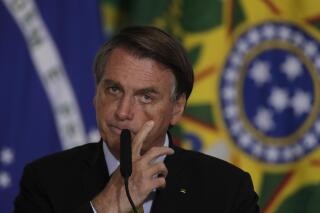 Brazil's President Jair Bolsonaro speaks during a ceremony to launch the new registration system for Professional Fishermen and Fishing Network, at the Planalto presidential palace in Brasilia, Brazil, Tuesday, June 29, 2021. (AP Photo/Eraldo Peres)