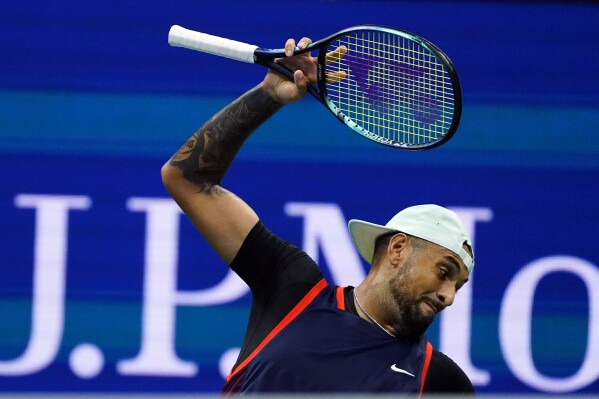 Nick Kyrgios, of Australia, tosses his racket as he plays Karen Khachanov, of Russia, during the quarterfinals of the U.S. Open tennis championships, Tuesday, Sept. 6, 2022, in New York. (AP Photo/Frank Franklin II, File)