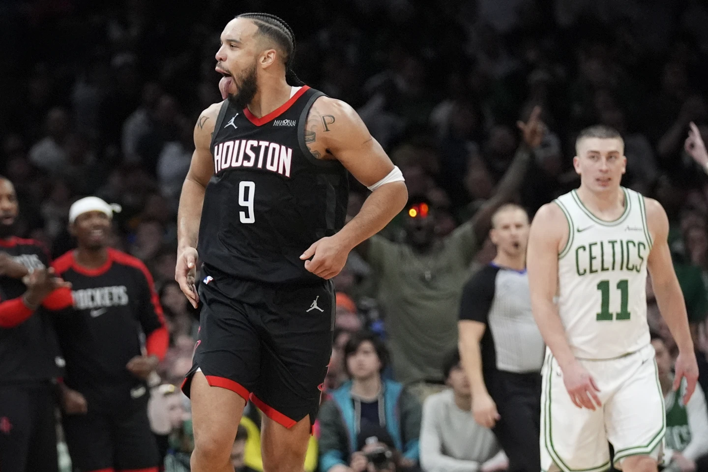 Houston Rockets forward Amen Thompson (1) makes the winning shot against the Boston Celtics during the final seconds of an NBA basketball game, Monday, Jan. 27, 2025, in Boston.