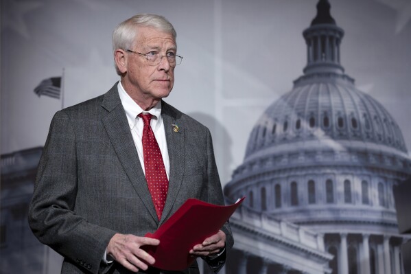 FILE - Senate Armed Services Committee Ranking Member Roger Wicker, R-Miss., meets with reporters during a news conference at the Capitol in Washington, Jan. 11, 2024. The top Republican on a Senate committee that oversees the U.S. military is making an argument for aggressively increasing defense spending over negotiated spending caps. Sen. Roger Wicker, a Mississippi Republican, is releasing a plan for a “generational investment” that seeks to deter coordinated threats from U.S. adversaries like Russia, Iran and China. (AP Photo/J. Scott Applewhite, File)