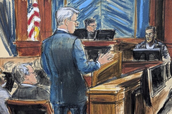 Defense attorney Brian Steel, center, cross examines Kid Cudi, far right, as Sean "Diddy" Combs, far left, looks on during Combs' sex trafficking and racketeering trial in Manhattan federal court,Thursday, May 22, 2025, in New York. (Elizabeth Williams via AP)