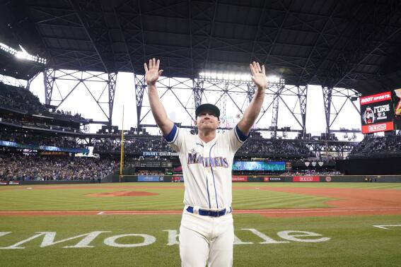 FILE - Seattle Mariners third baseman Kyle Seager waves to fans after a baseball game against the Los Angeles Angels Sunday, Oct. 3, 2021, in Seattle. Seager announced his retirement on Wednesday, Dec. 29, 2021, after 11 seasons in the majors, all with the Mariners.  (AP Photo/Elaine Thompson, File)