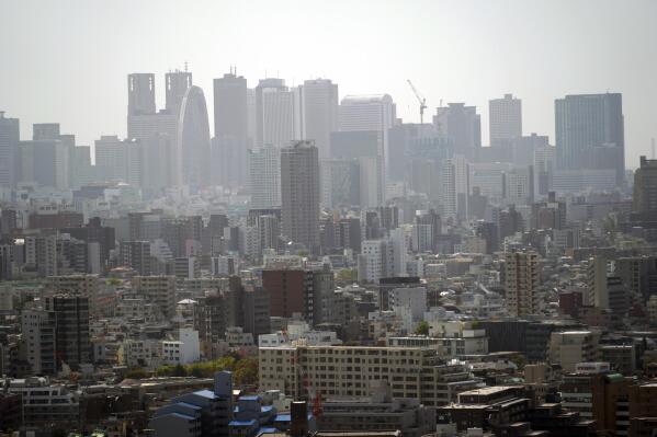 Landscape is seen in Tokyo on March 31, 2021. The Japanese economy contracted at an annual rate of 5.1% in January-March, slammed by a plunge in spending over the coronavirus pandemic, according to government data released Tuesday, May 18, 2021. (AP Photo/Eugene Hoshiko)