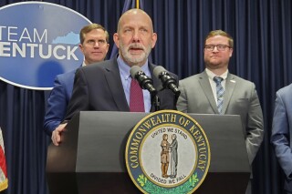 Rye Development CEO Paul Jacob talks about his company's plans to build a $1.3 billion coal-to-pumped storage hydropower facility as Gov. Andy Beshear looks on during a news conference, Thursday, March 21, 2024 in Frankfort, Ky. Jacob says the project will create about 1,500 construction jobs and 30 operations jobs once the facility is operational. (Tom Latek/Kentucky Today via AP)