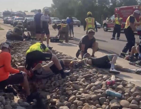 This photo provided by Tony Quinones shows the aftermath of a truck ramming into a crowd of bikers Saturday, June 19, 2021, in Show Low, Ariz. Authorities in the small city of Show Low said the unidentified 35-year-old male suspect fled the crash scene in the pickup and was shot and wounded by officers a short time later.  Of the seven cyclists hospitalized, six were in critical condition, and one was in stable condition on Sunday, June 20, 2021, police said in a statement. (Tony Quinones via AP)