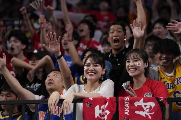 Japan's supporters cheer the team during the second half of their Basketball World Cup classification match against Cape Verde in Okinawa, southern Japan, Saturday, Sept. 2, 2023. (AP Photo/Hiro Komae)