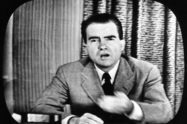 Richard Nixon, Republican candidate for the Vice Presidency, explains an $18,000 expense fund on national television, September 23, 1952.  The appearance was nicknamed his "Checkers" speech because of his reference to the family dog, the one contribution he admitted receiving, from a Texas supporter who gave his family a cocker spaniel.  (AP Photo)