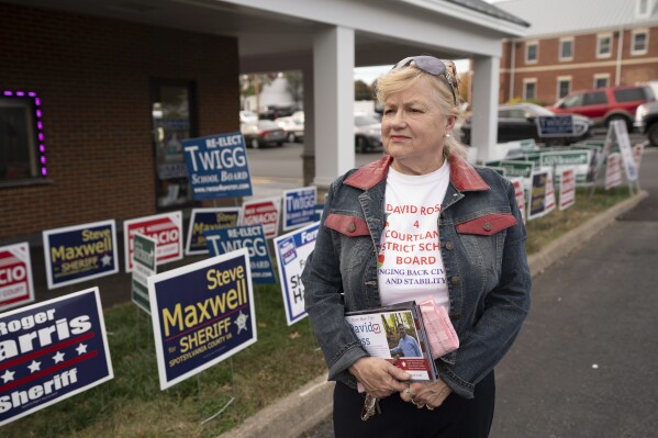 Dale Swanson, chair of Rappahannock Conservative Women's Coalition, poses for a portrait at the Spotsylvania county early voting site in Fredericksburg, Va., Thursday, Oct. 26, 2023. (AP Photo/Serkan Gurbuz)