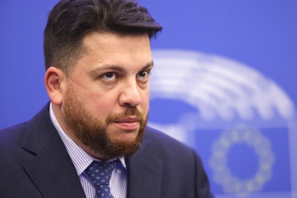 FILE - Russia's Leonid Volkov, Chief of staff for the 2018 presidential election for Alexei Navalny's campaign, looks on, at the European Parliament in Strasbourg, eastern France, Dec. 15, 2021. Associates of the late opposition leader Alexei Navalny reported on Tuesday night that the politician’s close ally and top strategist was attacked near his home in Lithuania. Navalny’s spokesman Kira Yarmysh said the assailant smashed a window of Leonid Volkov’s car, sprayed tear gas into his eyes and started hitting him with a hammer. (AP Photo/Jean-Francois Badias, File)