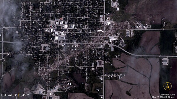 This satellite photo taken by a BlackSky Technology satellite on Wednesday, May 22, 2024, shows the damage a tornado caused when it tore through Greenfield, Iowa, a day prior, Tuesday, May 21. (BlackSky Technology via AP)