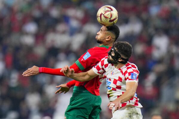 Morocco's Youssef En-Nesyri, left, and Croatia's Josko Gvardiol fight for the ball during the World Cup third-place playoff soccer match between Croatia and Morocco at Khalifa International Stadium in Doha, Qatar, Saturday, Dec. 17, 2022. (AP Photo/Hassan Ammar)