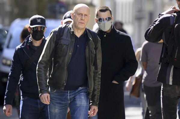 French-Swiss far-right writer Alain Soral, left, arrives at the courthouse for his appeal trial for homophobia against a journalist, in Lausanne, Switzerland, Wednesday, September 27, 2023. The court ruled that Swiss-French essayist Alain Soral must spend 60-day in prison over a case of discrimination, defamation and incitation to hatred for deriding a newspaper journalist as a “fat lesbian.” (Laurent Gillieron/Keystone via AP)