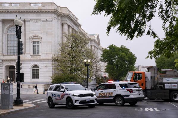 Police vehicles and heavy trucks block access to Supreme Court Building in Washington, Wednesday, May 4, 2022, as security measure are enhanced on the perimeter following protests sparked by news that the court might overturn cases that guarantee abortions. More demonstrations are expected in the wake of a Politico story about Supreme Court Justice Samuel Alito's draft majority opinion, which sets the stage for the court to overturn Roe v. Wade and Planned Parenthood v. Casey. (AP Photo/J. Scott Applewhite)