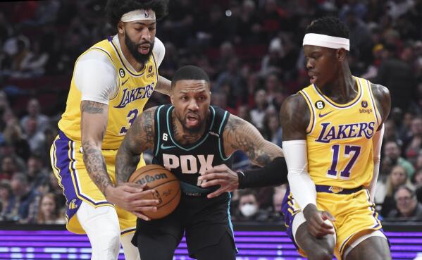 Los Angeles Lakers forward LeBron James (23) points at a team mate during  the second half of an NBA basketball game against the Portland Trail  Blazers Friday, Feb. 26, 2021, in Los