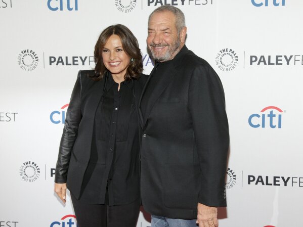 FILE - This Oct. 13, 2014 file photo shows Mariska Hargitay, left, and Dick Wolf, at the PaleyFest New York "Law & Order: SVU" panel discussion in New York. The show’s 21st season premieres on Sept. 26. (Photo by Andy Kropa/Invision/AP, File)