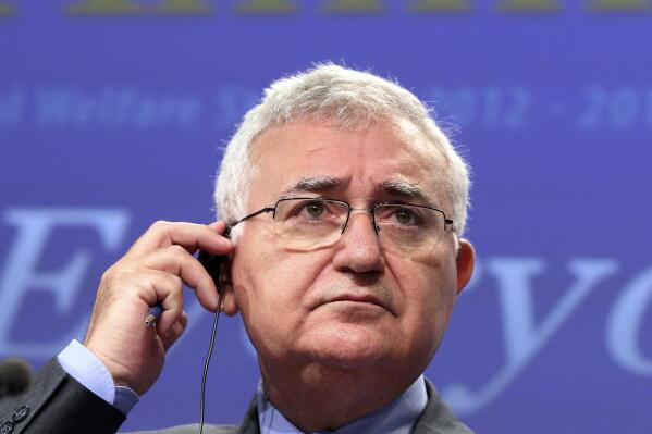 FILE - European Commissioner for Health and Consumer Policy John Dalli addresses the media at the European Commission headquarters in Brussels Jan. 19, 2012. A former European Union health commissioner has on Wednesday, Feb. 9, 2022 pleaded innocent in a Maltese courtroom to charges of bribery and influence trading bribery charges. John Dalli, who is Maltese, served in the commission post from 2010 to 2012.  (AP Photo/Yves Logghe, file)