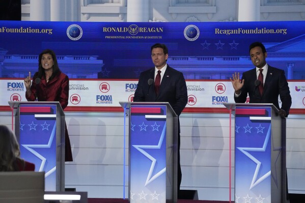 FILE - Former U.N. Ambassador Nikki Haley, left, argues a point with businessman Vivek Ramaswamy, right, between Florida Gov. Ron DeSantis, center, during a Republican presidential primary debate hosted by FOX Business Network and Univision, Wednesday, Sept. 27, 2023, at the Ronald Reagan Presidential Library in Simi Valley, Calif. (AP Photo/Mark J. Terrill, File)