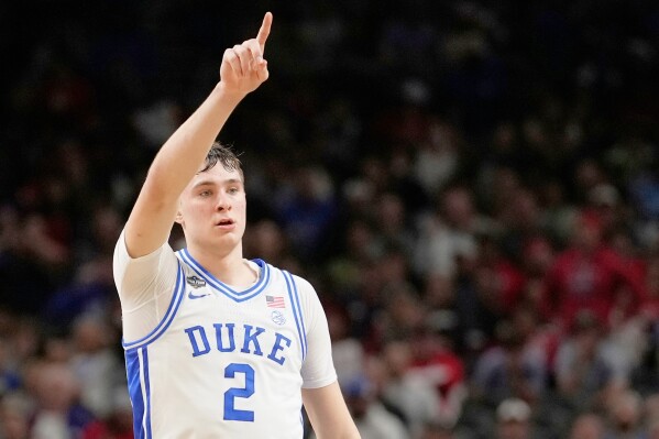 Duke forward Cooper Flagg celebrates after scoring against the Houston during the second half in the national semifinals at the Final Four of the NCAA college basketball tournament, Saturday, April 5, 2025, in San Antonio. (AP Photo/Brynn Anderson, File)