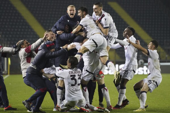 Bologna players celebrate after the goal of 0-1 of Giovanni Fabbian during the Serie A soccer match between Empoli and Bologna at Castellani Stadium Empoli, Empoli, Italy, Friday March 15, 2024. (Marco Bucco/LaPresse via AP)