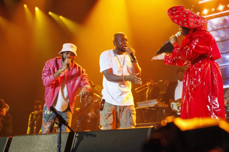 Pras, from left, Wyclef Jean, and Lauryn Hill of the Fugees perform during 