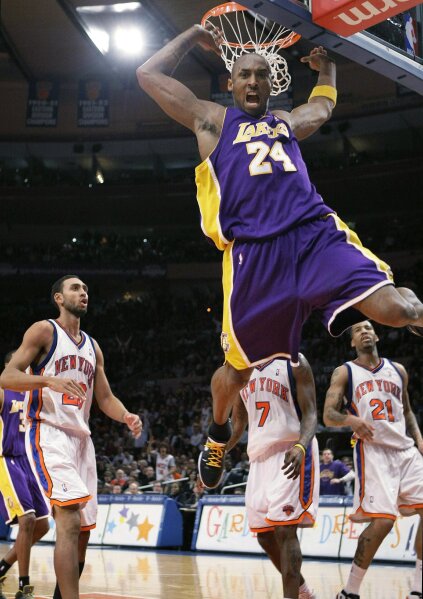 Kobe Bryant of the Los Angeles Lakers goes for a dunk against the