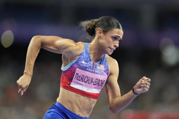 Sydney McLaughlin-Levrone, of the United States competes in the women's 400 meters hurdles final at the 2024 Summer Olympics, Thursday, Aug. 8, 2024, in Saint-Denis, France. (AP Photo/Ashley Landis)