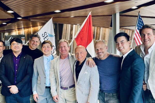 From left to right: Andrew Wind, Self Esteem Brands; Ben Matute, Anytime Fitness UAE master franchisee; Chuck Runyon, CEO, Self Esteem Brands; John Ninia, Anytime Fitness UAE master franchisee; Tony Mitchell, Self Esteem Brands; Dr. Mark Mobius, Anytime Fitness UAE master franchisee; Dave Mortensen, president, Self Esteem Brands; Richmond Sy, Anytime Fitness UAE master franchisee; Sander Van den Born, Self Esteem Brands. Location: Self Esteem Brands, Woodbury, MN USA