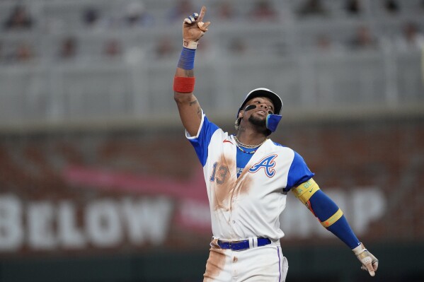 Atlanta Braves' Ronald Acuna Jr. reacts after hitting a double in the fifth inning of a baseball game against the Washington Nationals, Saturday, Sept. 30, 2023, in Atlanta. (AP Photo/John Bazemore)