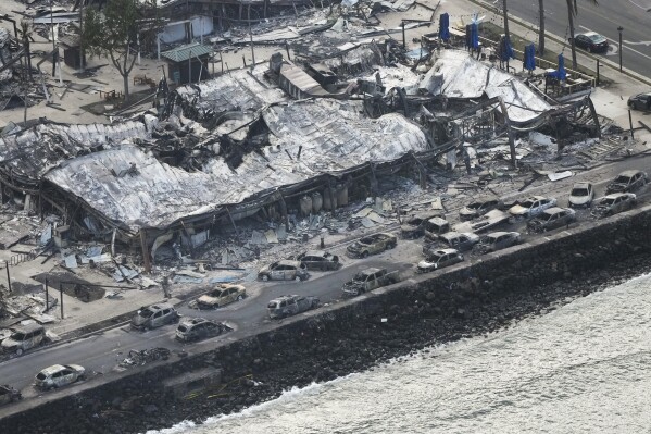 Wildfire wreckage is seen Thursday, Aug. 10, 2023, in Lahaina, Hawaii. The search of the wildfire wreckage on the Hawaiian island of Maui on Thursday revealed a wasteland of burned out homes and obliterated communities as firefighters battled the deadliest blaze in the U.S. in recent years. (AP Photo/Rick Bowmer)