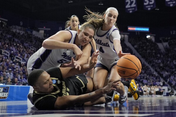Kansas State center Ayoka Lee, top left, and guard Serena Sundell (4) chase a loose ball with Colorado forward Quay Miller (11) during the second half of a second-round college basketball game in the women's NCAA Tournament in Manhattan, Kan., Sunday, March 24, 2024, in Manhattan, Kan. Colorado won 60-53. (AP Photo/Charlie Riedel)