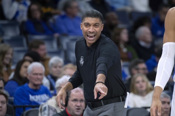 Austin Peay coach Corey Gipson gestures to players during the first half of the team's NCAA college basketball game against Memphis on Saturday, Dec. 30, 2023, in Memphis, Tenn. (AP Photo/Nikki Boertman)