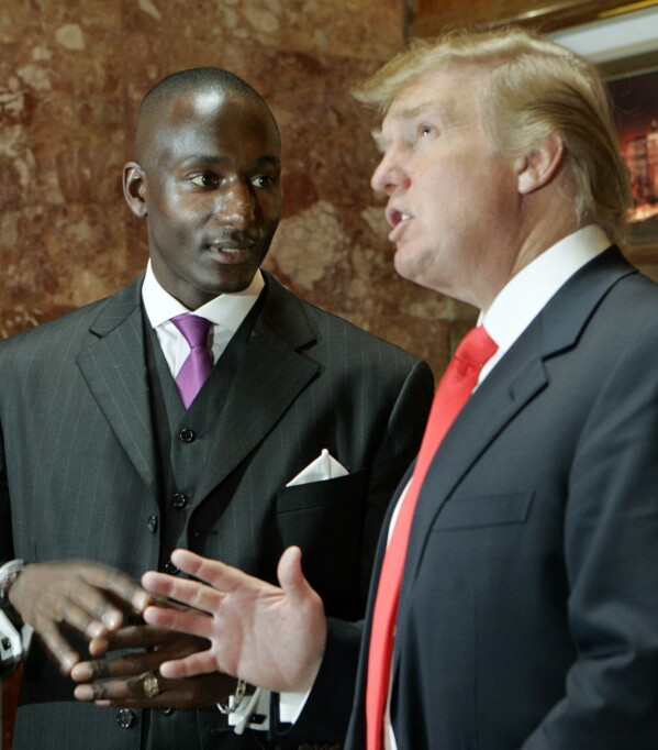 FILE - Donald Trump, right, speaks to Randal Pinkett, left, the winner of the fourth season of Trump's reality television show 