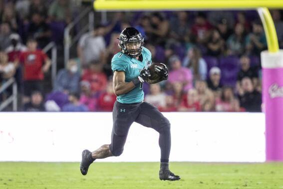 Coastal Carolina running back Braydon Bennett (1) runs the ball against Northern Illinois during the Cure Bowl NCAA college football game in Orlando, Fla., Friday, Dec. 17, 2021. (Willie J. Allen Jr./Orlando Sentinel via AP)
