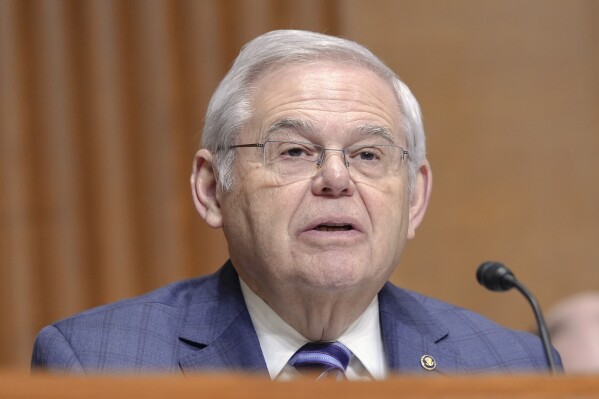 FILE - Sen. Bob Menendez, D-N.J., asks a question during a Senate Finance Committee hearing on Capitol Hill Thursday, March 14, 2024, in Washington. Menendez's bribery trial was moved forward a week to mid-May on Friday, April 18, 2024, after lawyers agreed the extra days would aid trial preparation. (AP Photo/Mariam Zuhaib, File)