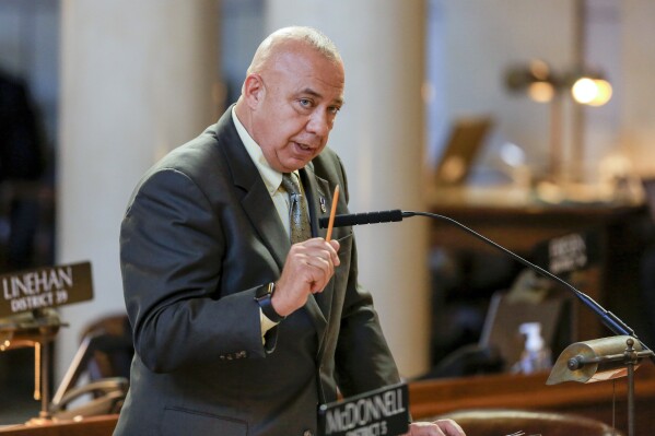 FILE - Neb. State Sen. Tom Brewer of Gordon speaks during debate, Jan. 8, 2018, in the Legislative Chamber in Lincoln, Neb. Brewer's bill, which would allow teachers and other staff in schools to be armed in the hopes of deterring school shootings, drew dozens of people and some emotional testimony to the Nebraska Legislature’s Education Committee on Tuesday, Feb. 6, 2024. (AP Photo/Nati Harnik, File)