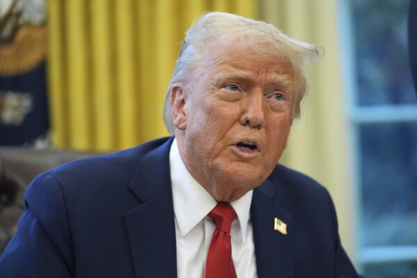 President Donald Trump speaks as he signs executive orders in the Oval Office of the White House, Monday, Feb. 3, 2025, in Washington. (AP Photo/Evan Vucci)