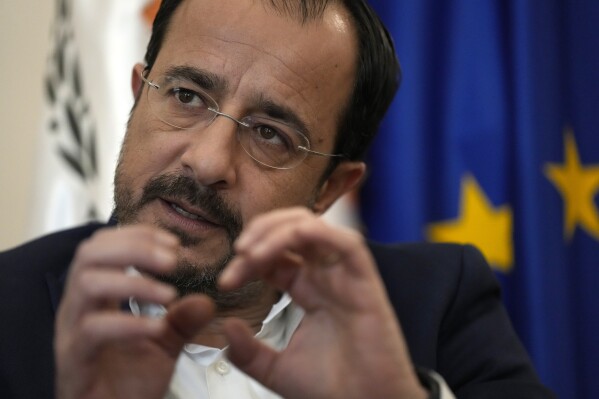 Cyprus President Nikos Christodoulides speaks during an interview with The Associated Press in his office at the Presidential Palace in Nicosia, Monday, Nov. 20, 2023. Cyprus is ready to “immediately” begin shipping large quantities of humanitarian aid to Gaza in vessels that can navigate shallow water once conditions on the ground allow for it, Christodoulides said Monday. (AP Photo/Petros Karadjias)