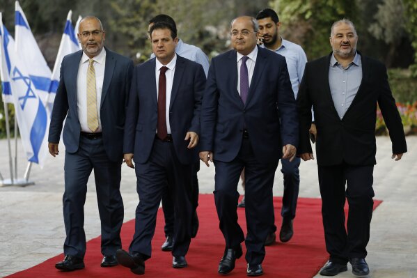 Members of the Joint List, from left to right, Osama Saadi, Ayman Odeh, Ahmad Tibi and Mansour Abbas arrive for a consulting meeting with Israeli President Reuven Rivlin, in Jerusalem, Sunday, Sept. 22, 2019. Rivlin began two days of crucial talks Sunday with party leaders before selecting his candidate for prime minister, after a deadlocked repeat election was set to make forming any new government a daunting task. (Menahem Kahana/Pool via AP)