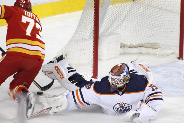 Calgary Flames goalie Jacob Markstrom makes a save against the Tampa Bay  Lightning during the second period of an NHL hockey game Thursday, March  10, 2022, in Calgary, Alberta. (Larry MacDougal/The Canadian