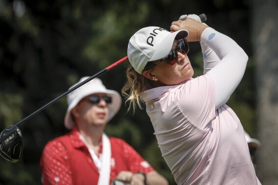 Lauren Coughlin, of the United States, hits a tee shot on the seventh hole during the second round at the LPGA Canadian Women's Open golf tournament in Calgary, Alberta, Friday, July 26, 2024. (Jeff McIntosh/The Canadian Press via ĢӰԺ)