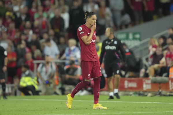 Liverpool's Darwin Nunez walks off the field after he was shown a red card during the English Premier League soccer match between Liverpool and Crystal Palace at Anfield stadium in Liverpool, England, Monday, Aug. 15, 2022. (AP Photo/Jon Super)