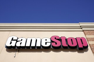 FILE - A GameStop sign is displayed above a store in Urbandale, Iowa, on Jan. 28, 2021. Gamestop’s highly-anticipated shareholder meeting ran into a technical problem Thursday, June 13, 2024 — resulting in many eager investors being unable to log on to the livestream. Computershare, the company hosting the webcast, confirmed that “unprecedented demand” from shareholders looking to access the meeting led to a technical issue. (AP Photo/Charlie Neibergall, File)