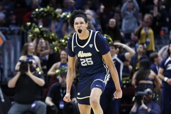 Akron's Enrique Freeman celebrates after a dunk against Kent State during the second half of an NCAA college basketball game for the championship of the Mid-American Conference men's tournament Saturday, March 12, 2022, in Cleveland. (AP Photo/Ron Schwane)