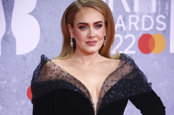FILE - Adele appears at the Brit Awards in London on Feb. 8, 2022. Adele paid homage to the many women - including her mother, grandmother and aunts - who helped shape her world and personality as she accepted the Sherry Lansing leadership award at The Hollywood Reporter's Women in Entertainment breakfast gala Thursday, Dec. 7, 2023. (Photo by Joel C Ryan/Invision/AP, File)