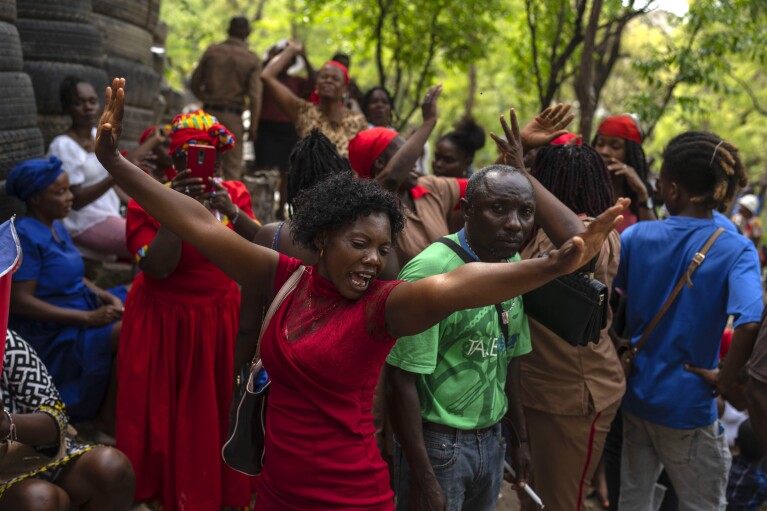FILE - Believers dance during the St. George vodou celebration in Port-au-Prince, Haiti, Wednesday, April 24, 2024. While spirits infuse believers with energy and hope, Vodou priests warn they don’t perform miracles. (AP Photo/Ramon Espinosa, File)