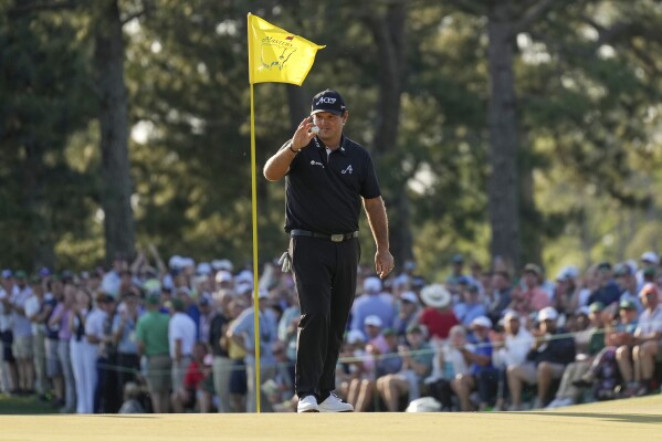 Patrick Reed celebrates after a eagle on the 17th hole during the final round at the Masters golf tournament, Sunday, April 13, 2025, in Augusta, Ga. (AP Photo/George Walker IV)