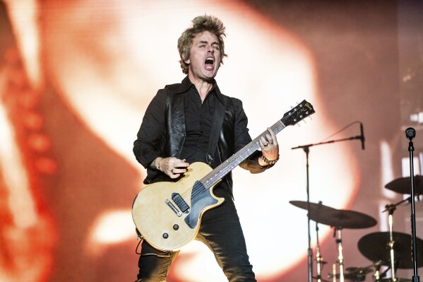 FILE - Billie Joe Armstrong of Green Day performs during the Louder Than Life Music Festival in Louisville, Ky., on Sept. 24, 2023. Green Day will headline a United Nations Human Rights-backed global climate concert on April 2 at the famed Fillmore in San Francisco. (Photo by Amy Harris/Invision/AP, File)