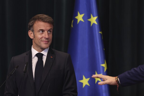 French President Emmanuel Macron attends a joint a press conference with Albanian Prime Minister Edi Rama in Tirana, Albania, Tuesday, Oct. 17, 2023. French President Emmanuel Macron continues his two-day visit to Tirana meeting with the Albanian president and prime minister. (AP Photo/Franc Zhurda)