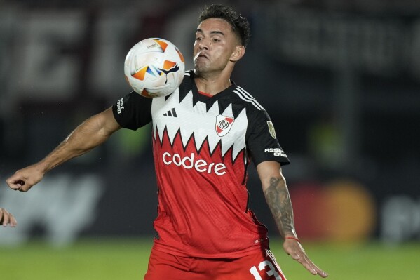 FILE - Claudio Echeverri of Argentina's River Plate plays the ball during a Copa Libertadores soccer match in Asuncion, Paraguay, on April 24, 2024. (AP Photo/Jorge Saenz, File)