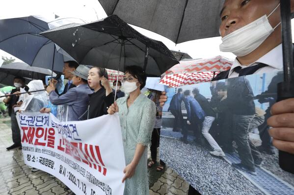 Members of North Korean human rights stage a rally to denounce South Korea's deportation of two North Korean fishermen in 2019, in front of the National Assembly in Seoul, South Korea, Wednesday, July 13, 2022. South Korean prosecutors raided the country’s main spy agency Wednesday as part of investigations into two past North Korea-related incidents that drew criticism that the previous liberal government ignored basic principles of human rights to improve ties with Pyongyang. (Lim Hun-jung/Yonhap via AP)